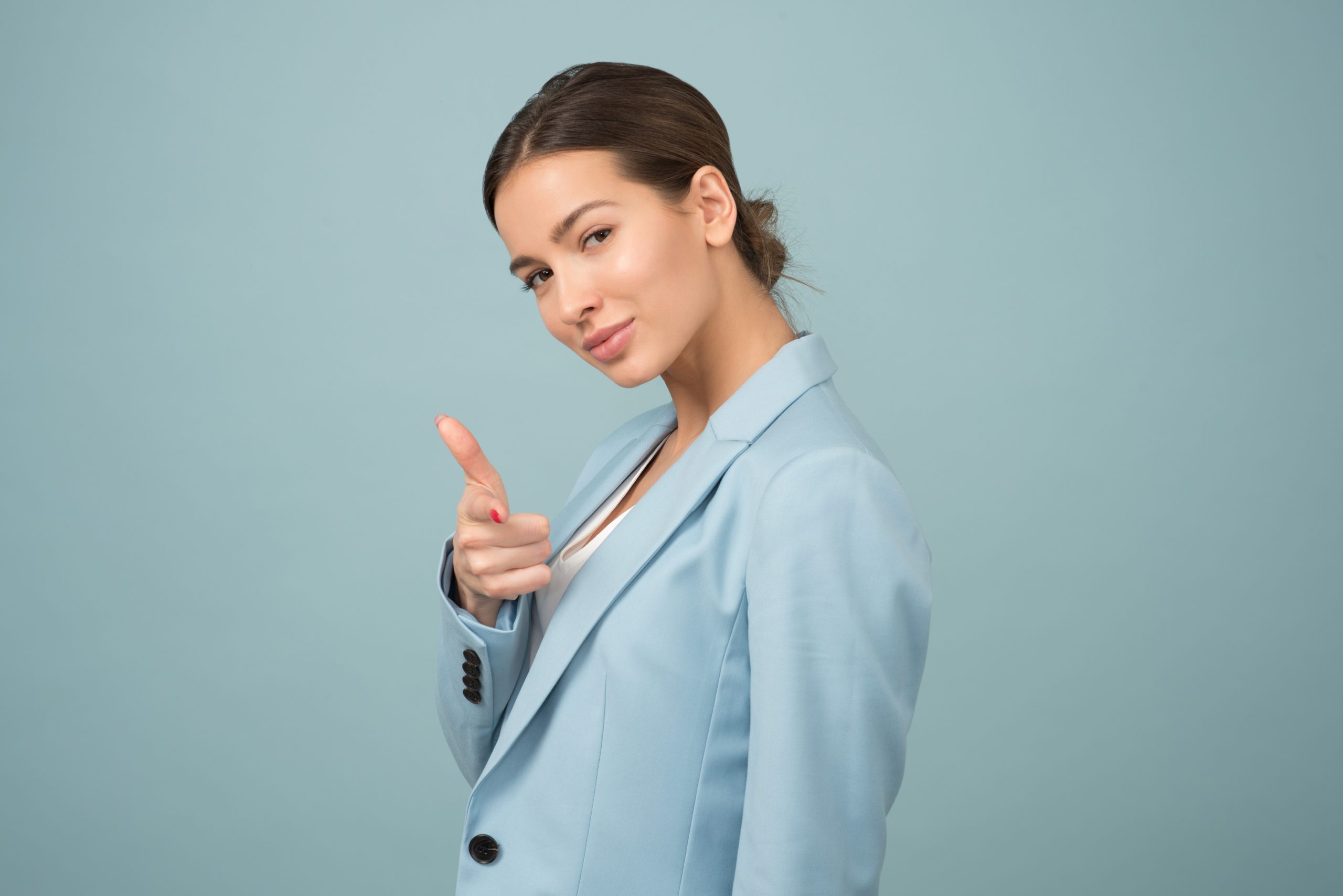 Canva – Woman Wearing Blue Shawl Lapel Suit Jacket