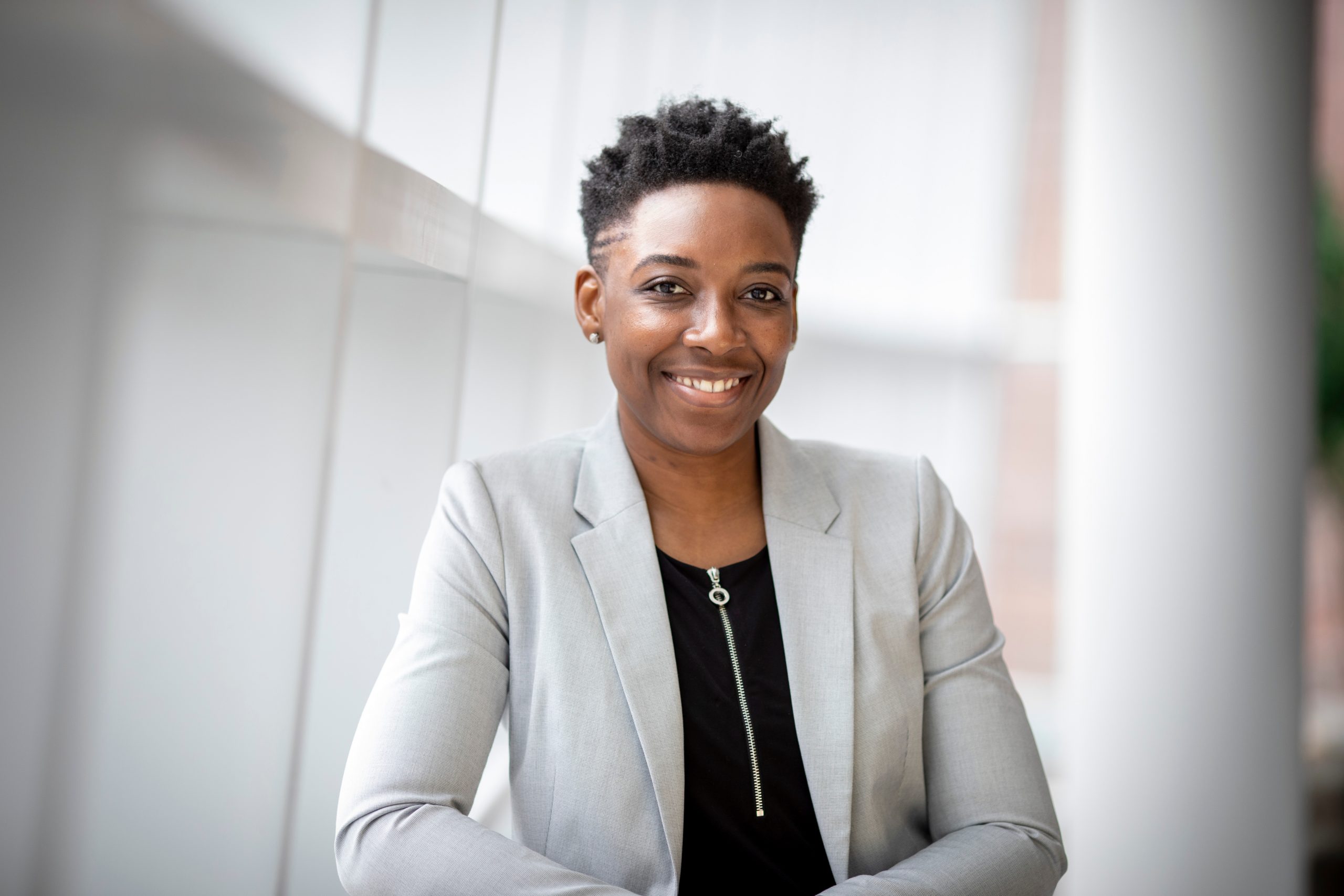 Canva – Woman Wearing Gray Notch Lapel Suit Jacket